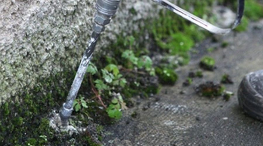 Pest treatment equipment at a building foundation (demo image)